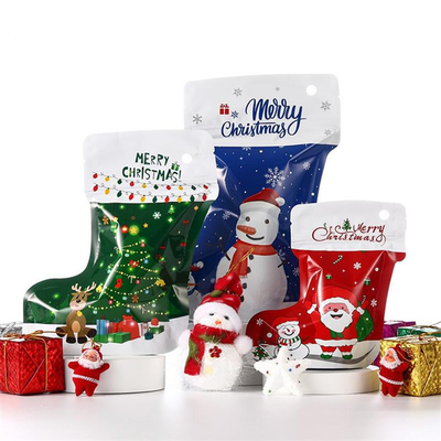 新年のクリスマスのアルミ ホイルの包装袋のサンタ クロースのヘラジカの党軽食の貯蔵